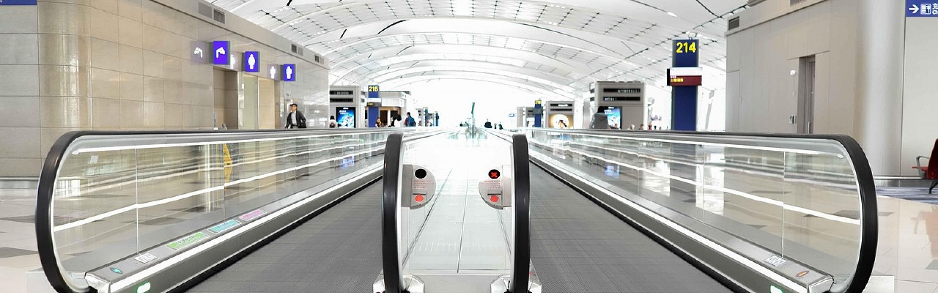 Traveler picking up a rental car at the airport